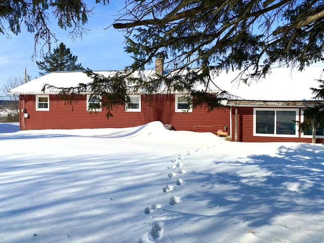 exterior space featuring a chimney