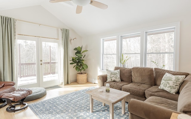 living area with lofted ceiling and a ceiling fan