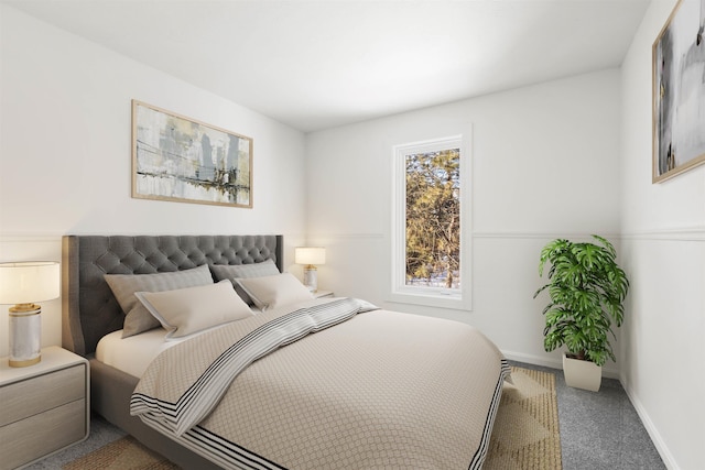 bedroom with carpet floors and baseboards