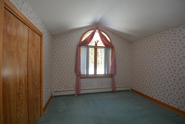 empty room featuring lofted ceiling, carpet floors, a baseboard radiator, and wallpapered walls