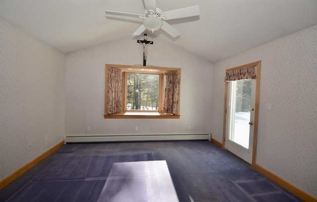 unfurnished room featuring lofted ceiling, plenty of natural light, and baseboard heating