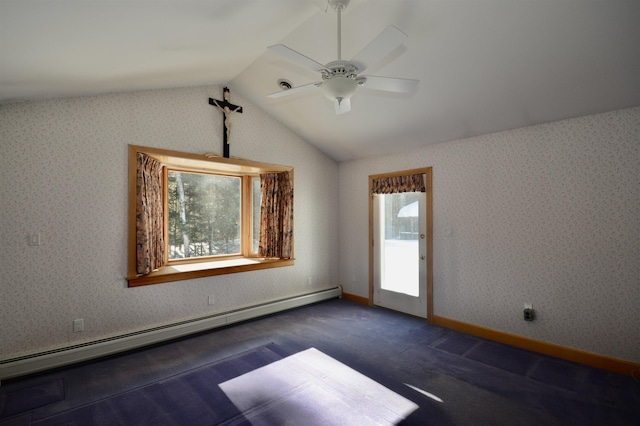 empty room featuring vaulted ceiling, baseboard heating, and wallpapered walls