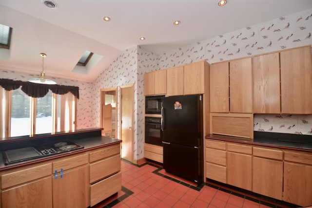 kitchen with lofted ceiling with skylight, dark countertops, black appliances, and wallpapered walls