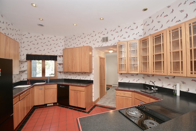 kitchen featuring glass insert cabinets and wallpapered walls