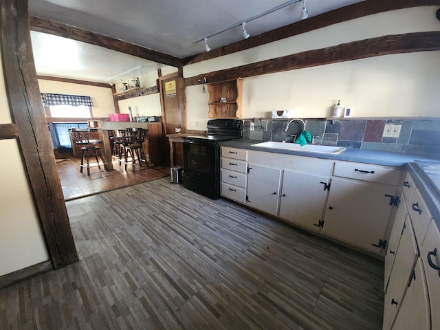 kitchen featuring white cabinets, black electric range oven, light countertops, open shelves, and a sink