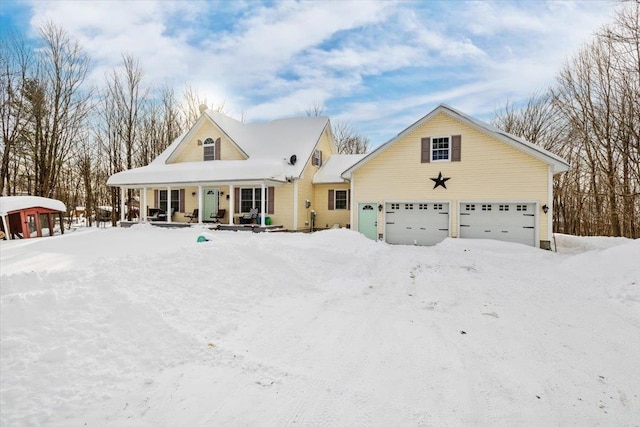 view of front facade with a garage and covered porch