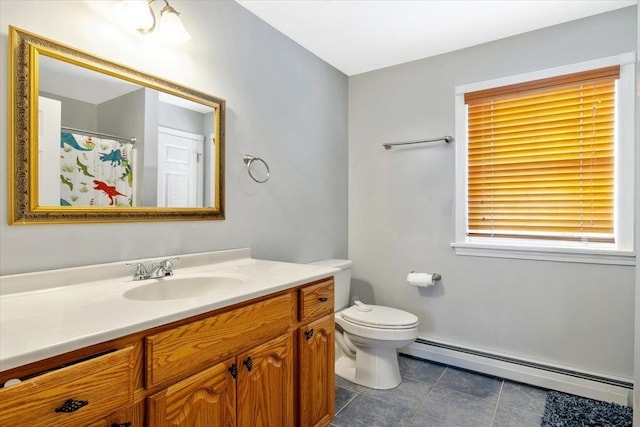 bathroom with toilet, a baseboard radiator, and vanity