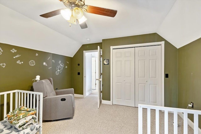 bedroom with light carpet, baseboards, a ceiling fan, vaulted ceiling, and a closet