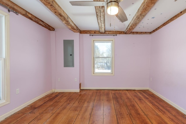 unfurnished room featuring electric panel, baseboards, a ceiling fan, wood finished floors, and beam ceiling