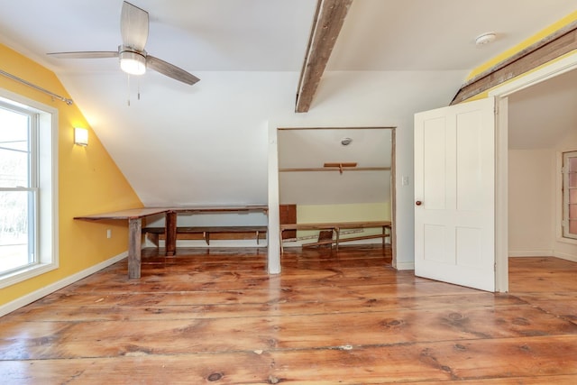 bonus room with lofted ceiling with beams, baseboards, a ceiling fan, and wood finished floors