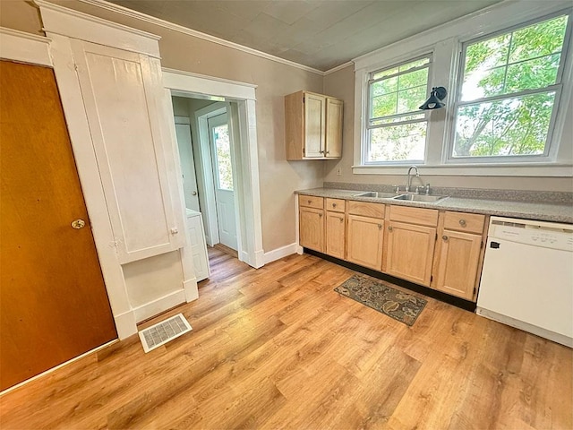 kitchen with visible vents, dishwasher, light countertops, light brown cabinetry, and a sink