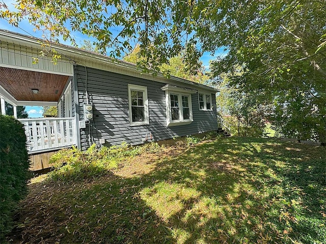 view of home's exterior featuring a lawn