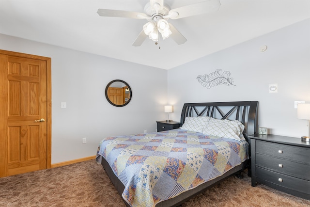 carpeted bedroom with ceiling fan and baseboards