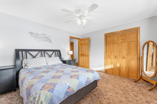 carpeted bedroom with a closet, a ceiling fan, and baseboards