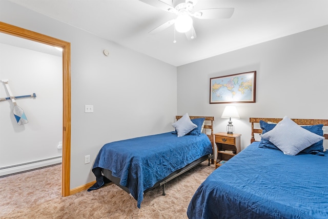 bedroom with light carpet, baseboard heating, a ceiling fan, and baseboards