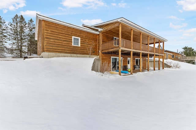 snow covered house with a balcony