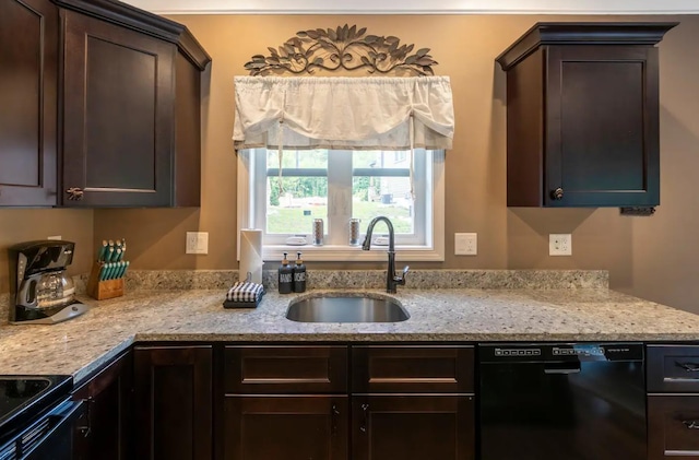 kitchen with black appliances, light stone counters, dark brown cabinets, and a sink