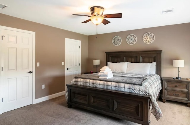 bedroom featuring light carpet, baseboards, visible vents, and ceiling fan