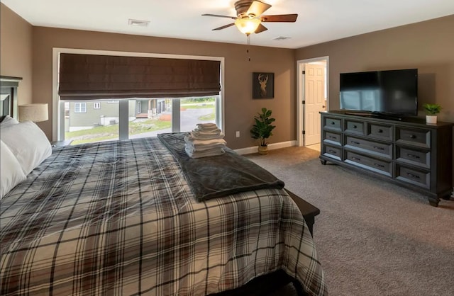 bedroom with a ceiling fan, carpet, visible vents, and baseboards