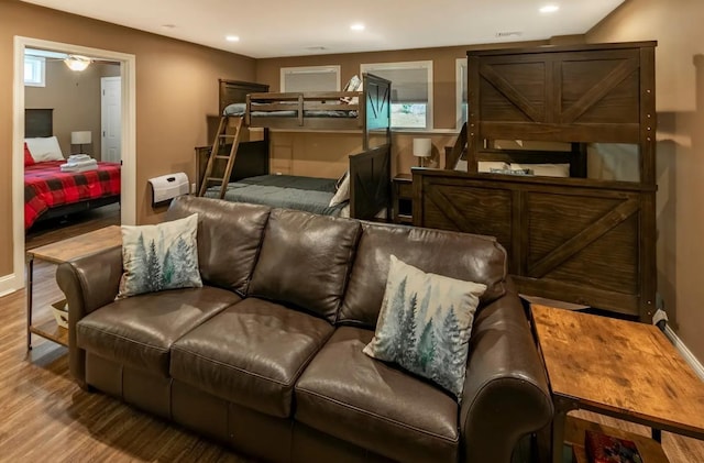 interior space with wood finished floors and recessed lighting