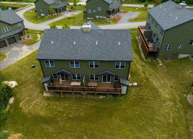 birds eye view of property with a residential view