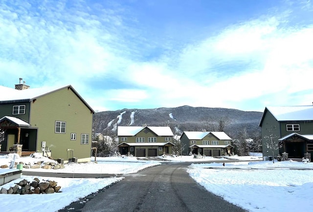 view of street with a residential view and a mountain view