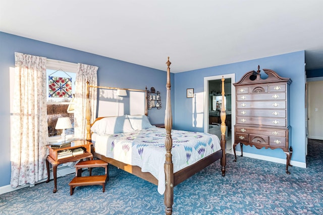 bedroom featuring carpet floors and baseboards