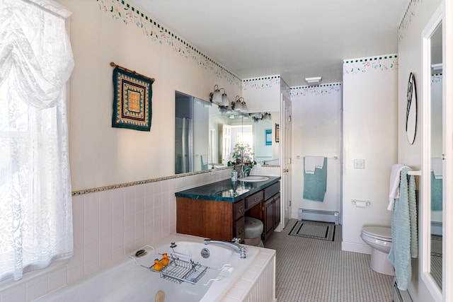 full bathroom with toilet, tile patterned floors, a jetted tub, baseboard heating, and vanity