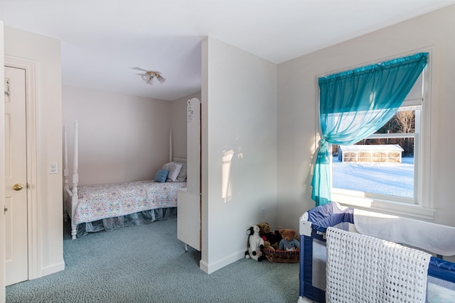 carpeted bedroom with baseboards