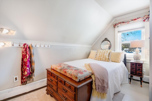 bedroom featuring a baseboard radiator and lofted ceiling