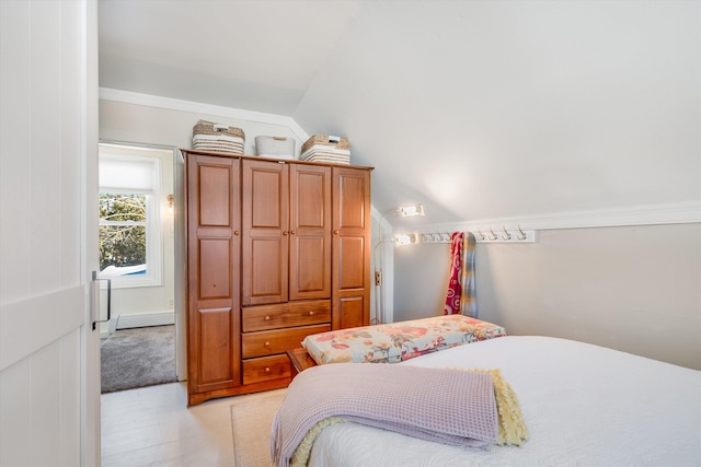 bedroom featuring lofted ceiling