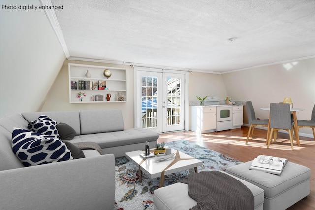 living area with a textured ceiling, french doors, wood finished floors, and crown molding