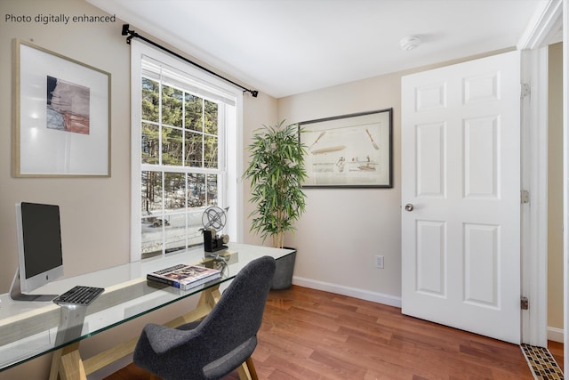 office area with baseboards and wood finished floors