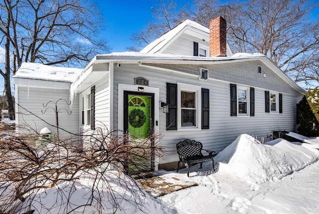 view of front of house featuring a chimney