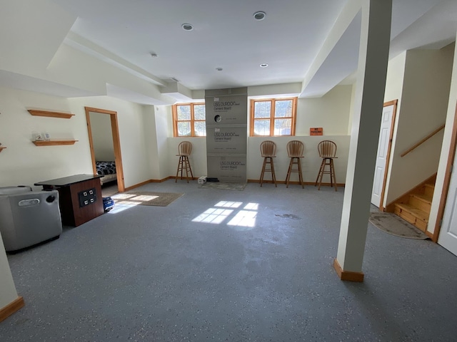 unfurnished living room with stairway