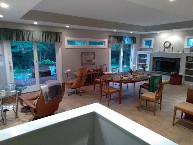 living room featuring recessed lighting and a fireplace