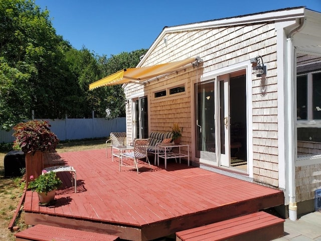 view of patio with fence and a deck