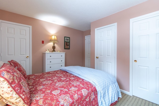 carpeted bedroom with baseboards