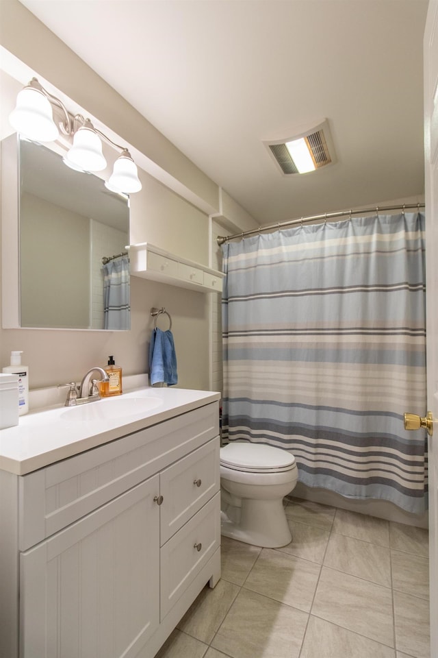 full bath with visible vents, vanity, toilet, and tile patterned floors