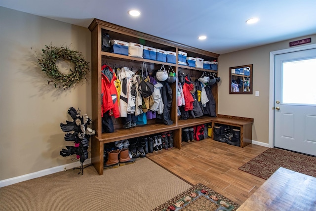 mudroom featuring wood finish floors, recessed lighting, and baseboards