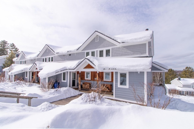 view of snow covered house