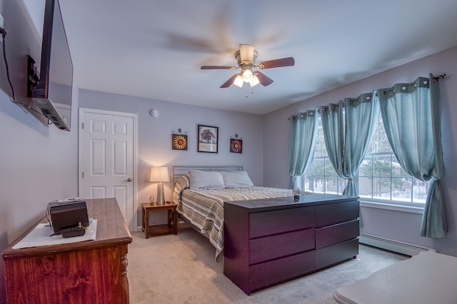 bedroom featuring a baseboard heating unit, ceiling fan, and light colored carpet