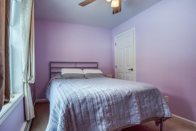 bedroom featuring a ceiling fan, carpet flooring, and baseboards