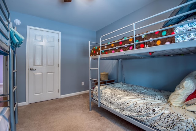 carpeted bedroom with baseboards