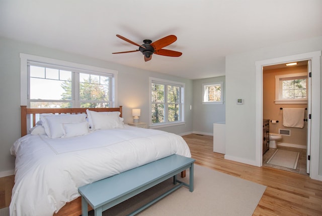 bedroom with light wood-type flooring, multiple windows, and visible vents