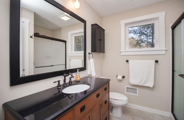 bathroom with toilet, vanity, visible vents, baseboards, and a shower stall