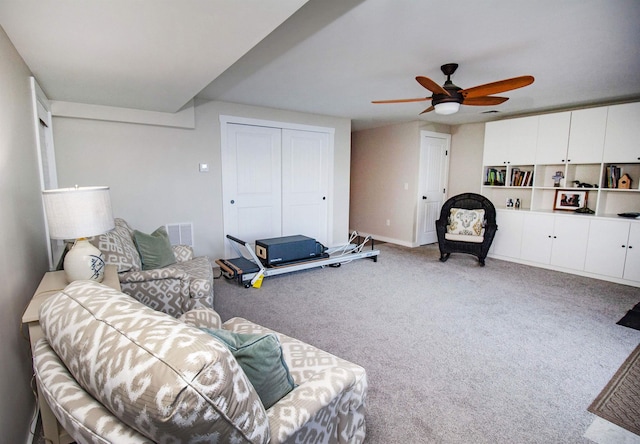 carpeted living room featuring visible vents and ceiling fan