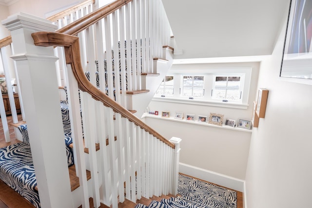 stairs featuring baseboards