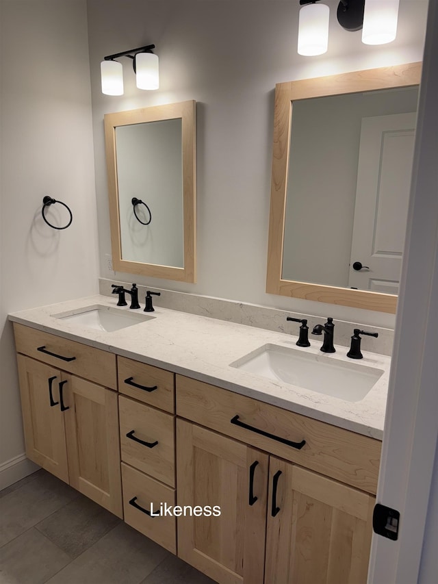 full bath with double vanity and a sink