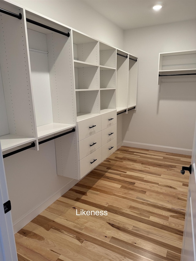 walk in closet featuring light wood-style floors